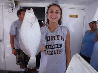 Lady with fluke on Sea Hunter